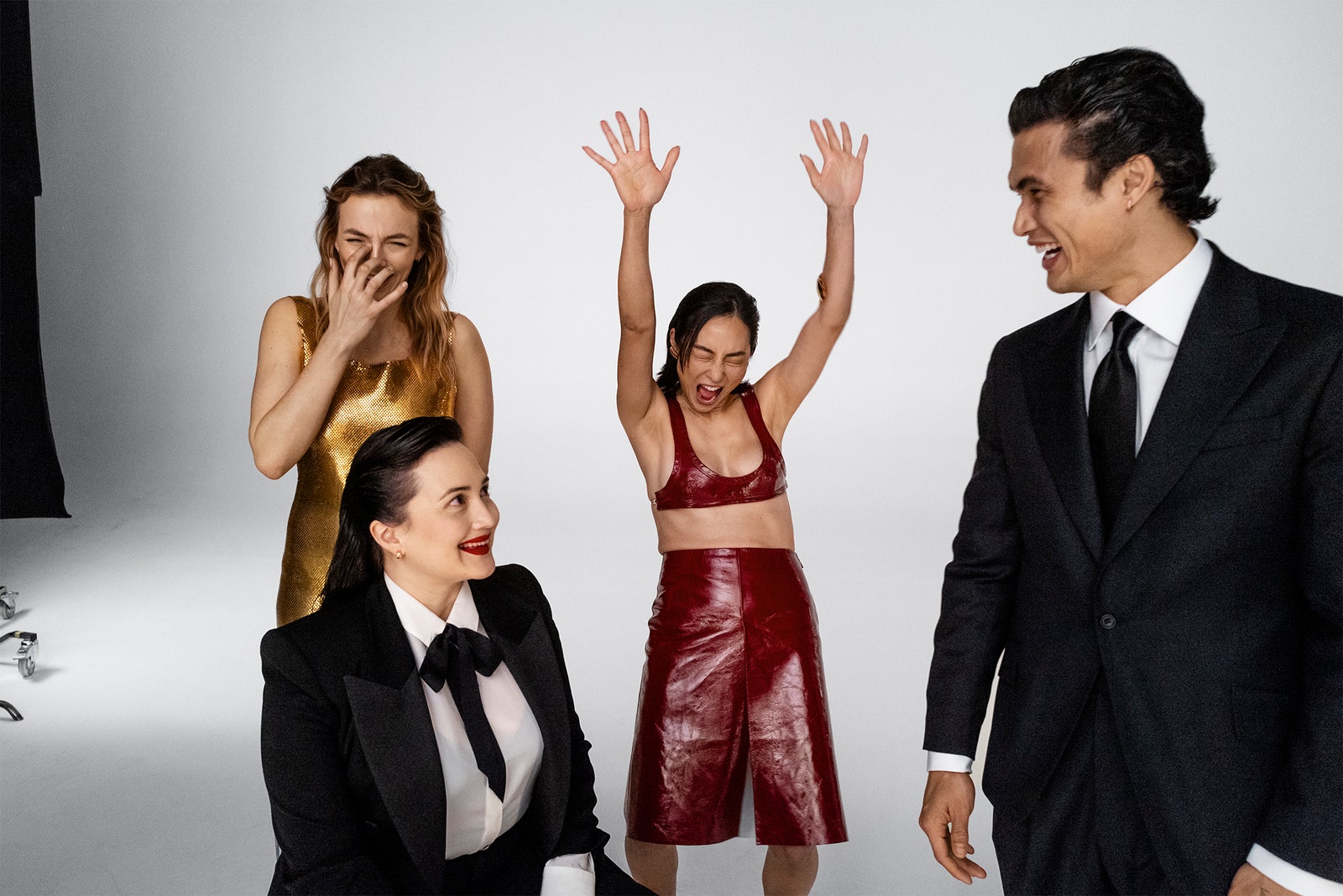 From left Jodie Comer Lily Gladstone Greta Lee and Charles Melton goofing around on the set of Vanity Fairs 2024...
