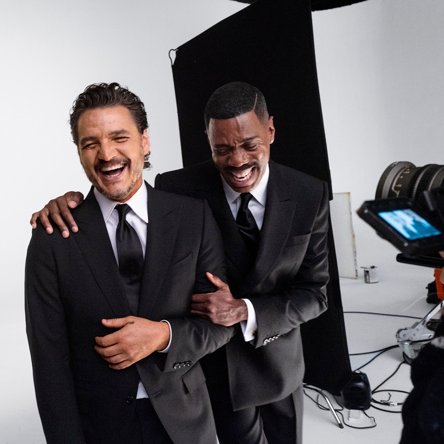 Pedro Pascal and Colman Domingo laughing behind the scenes of Vanity Fairs 2024 Hollywood Portfolio shoot. Pedro Pascals...