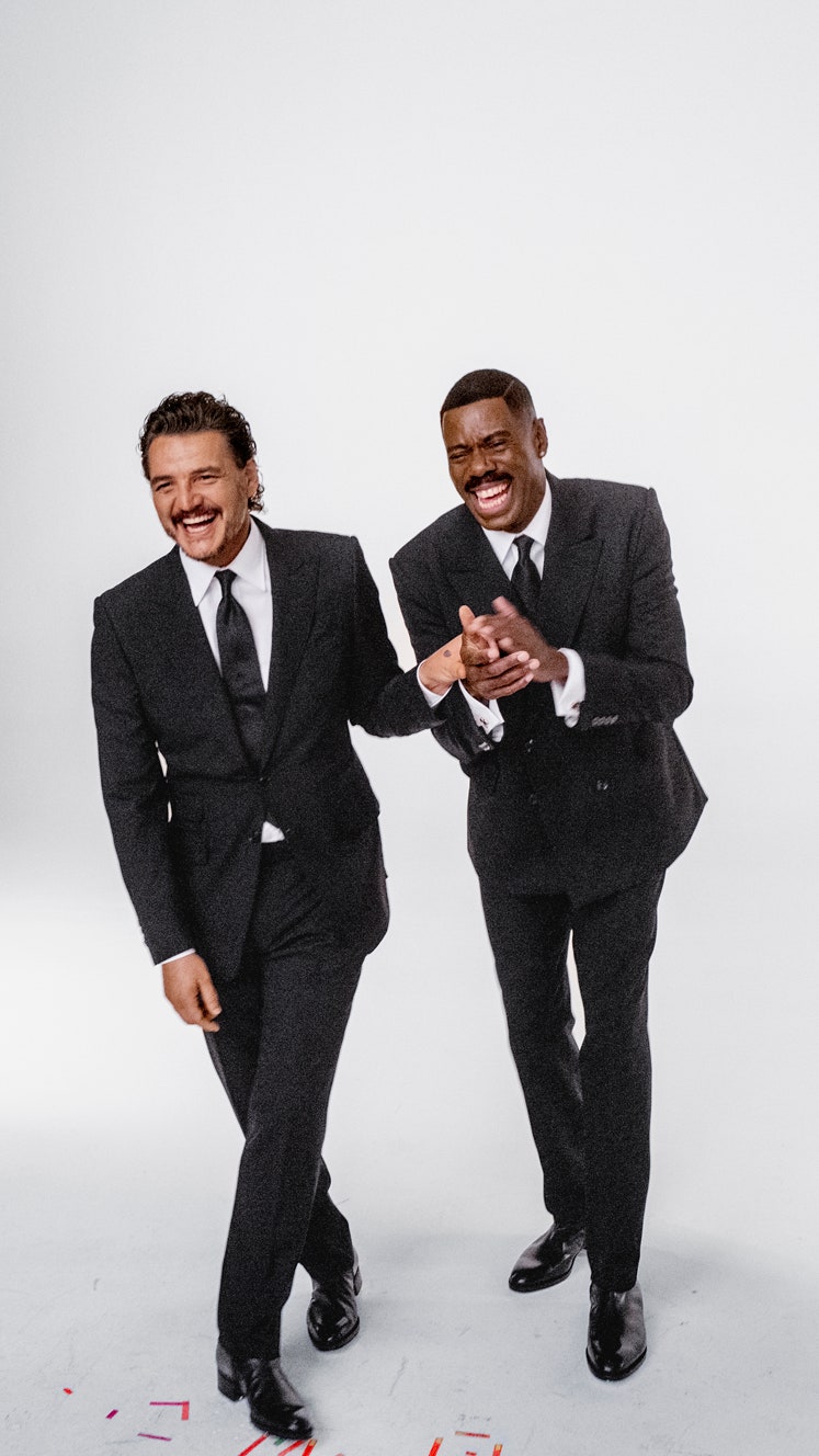 Pedro Pascal in a Tom Ford Tom Ford Charvet shirt and tie and John Lobb boots laughing behind the scenes with Colman...