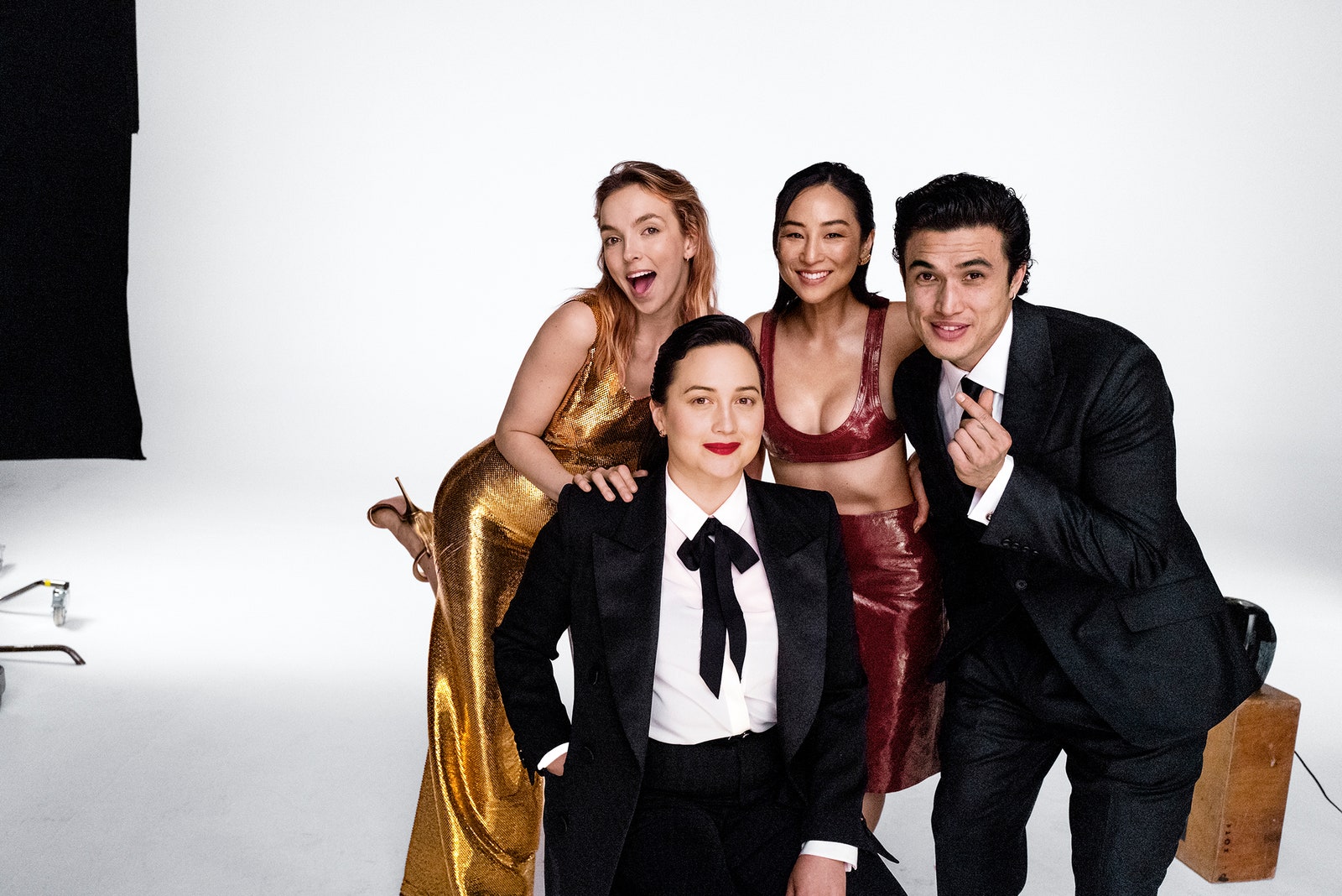 From left Jodie Comer Lily Gladstone Greta Lee and Charles Melton smile together on the set of Vanity Fairs 2024...