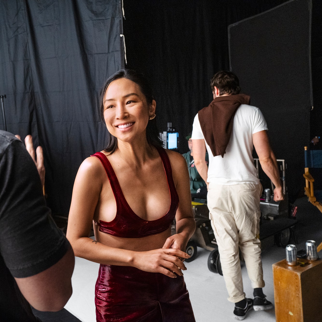 Greta Lee in a Gucci top and skirt Chanel Fine Jewelry cuff and Belperron ear clips behind the scenes at the 2024 Vanity...